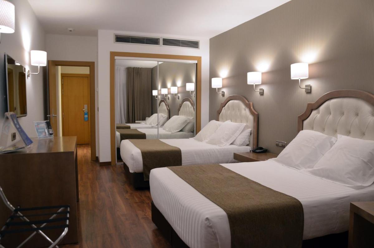 Cama o camas de una habitación en Beatriz Toledo Auditorium & Spa