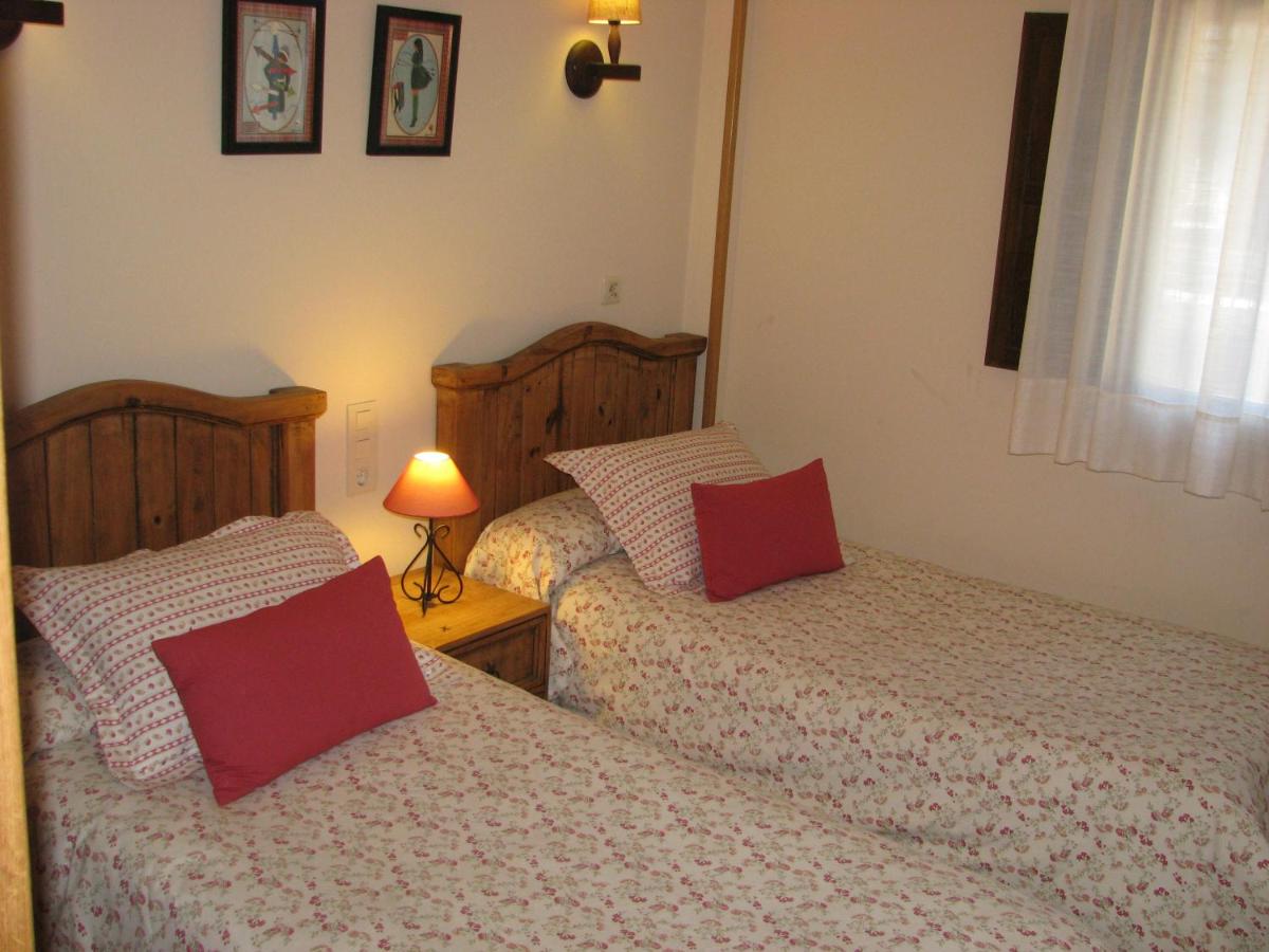 Cama o camas de una habitación en Aparthotel Sarrato