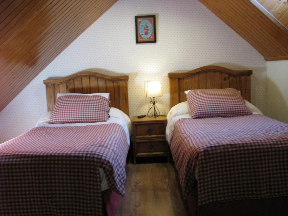 Cama o camas de una habitación en Aparthotel Sarrato