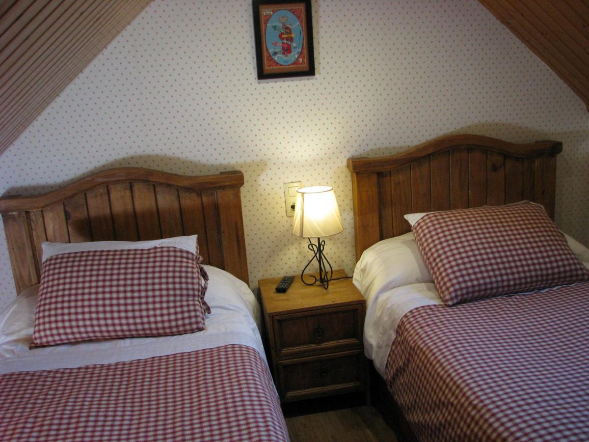 Cama o camas de una habitación en Aparthotel Sarrato