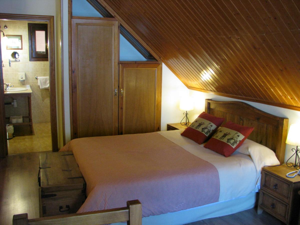 Cama o camas de una habitación en Aparthotel Sarrato