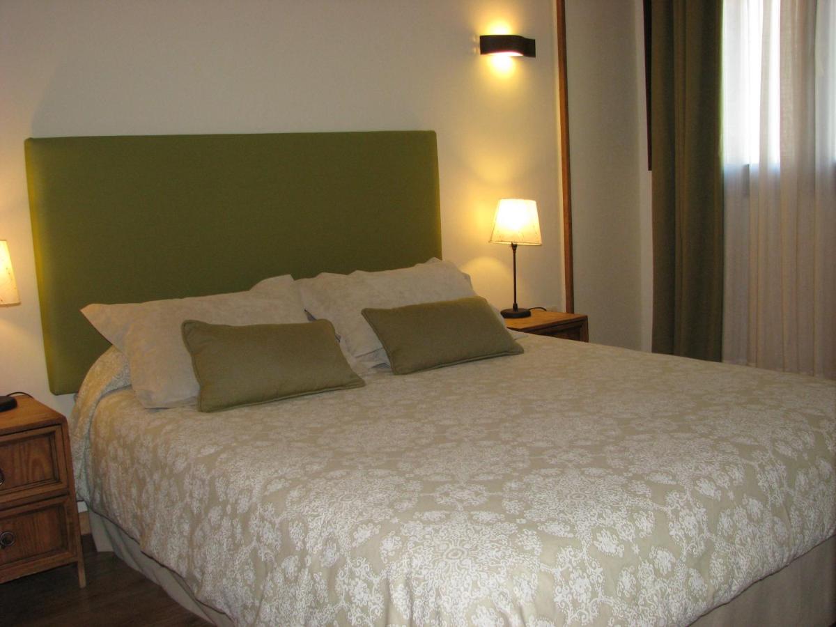 Cama o camas de una habitación en Aparthotel Sarrato