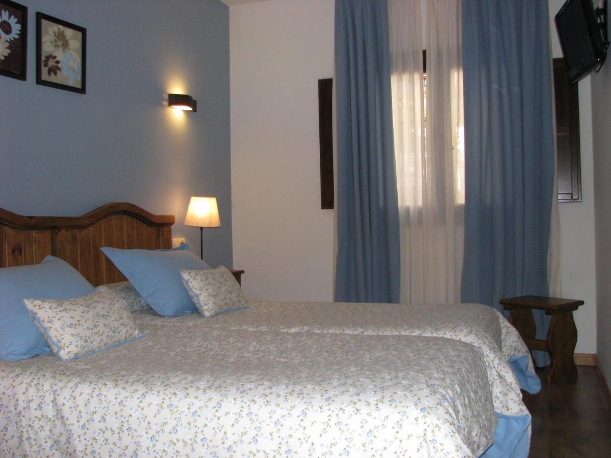 Cama o camas de una habitación en Aparthotel Sarrato