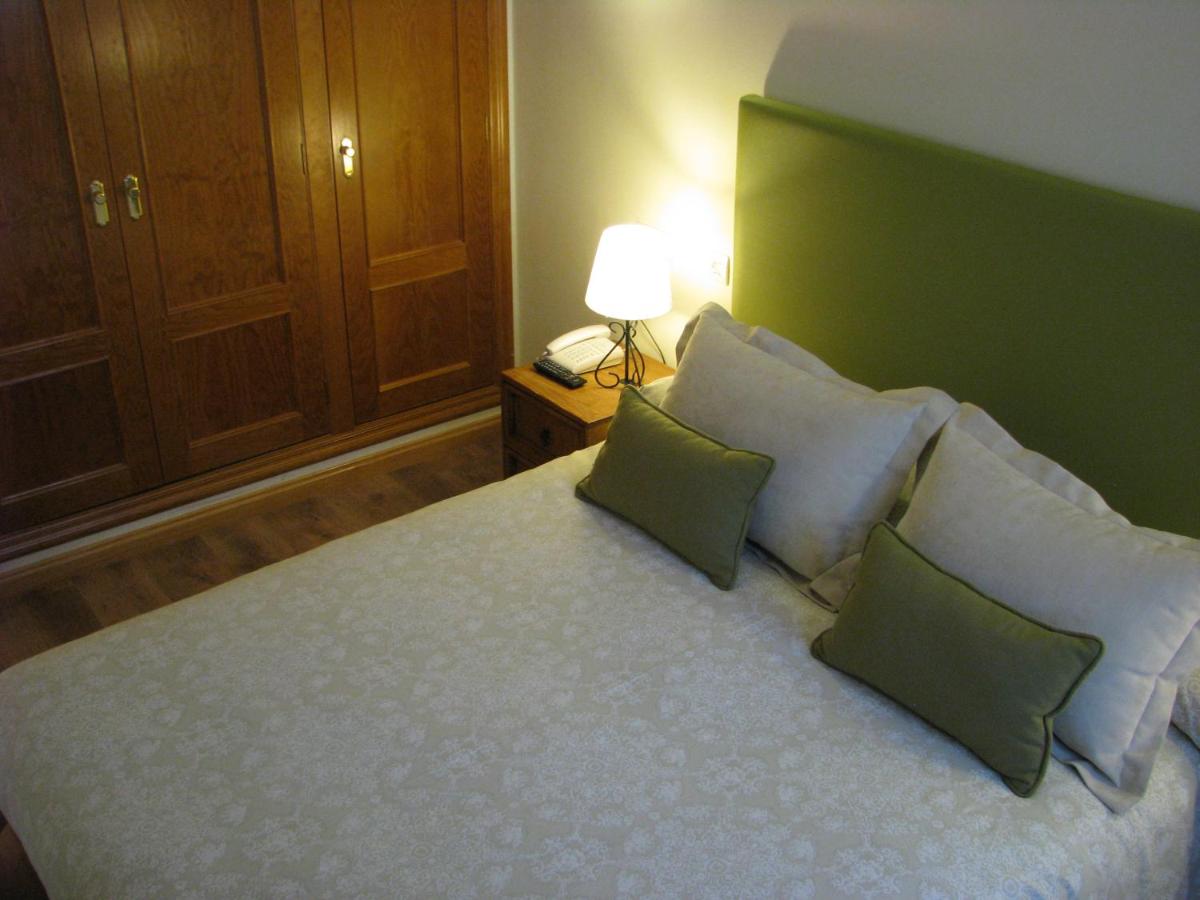 Cama o camas de una habitación en Aparthotel Sarrato