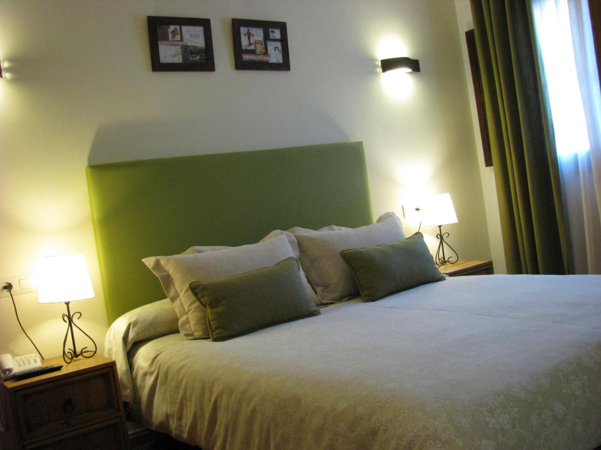 Cama o camas de una habitación en Aparthotel Sarrato