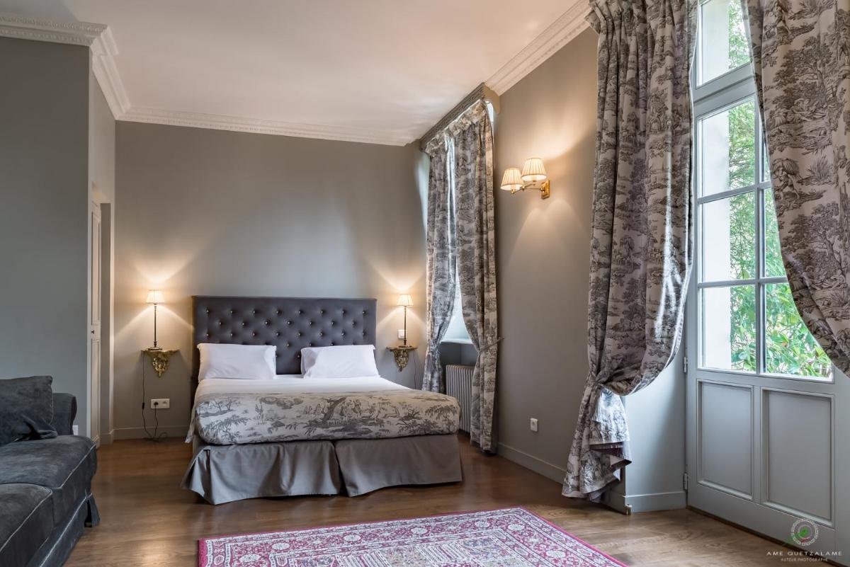 Un ou plusieurs lits dans un hébergement de l'établissement Hôtel Restaurant Spa Le Sauvage