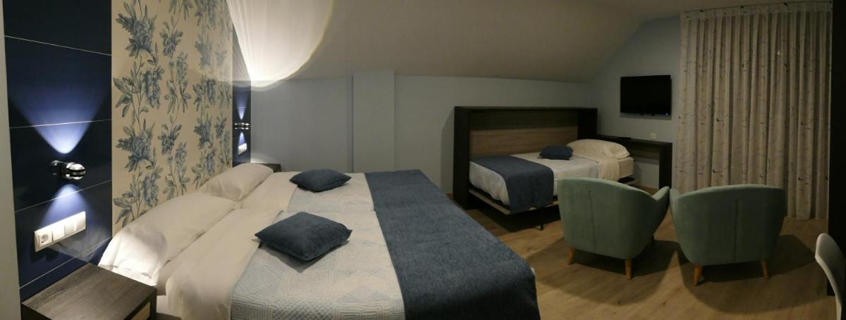 Cama o camas de una habitación en Hotel Rural El Nido de Pinares