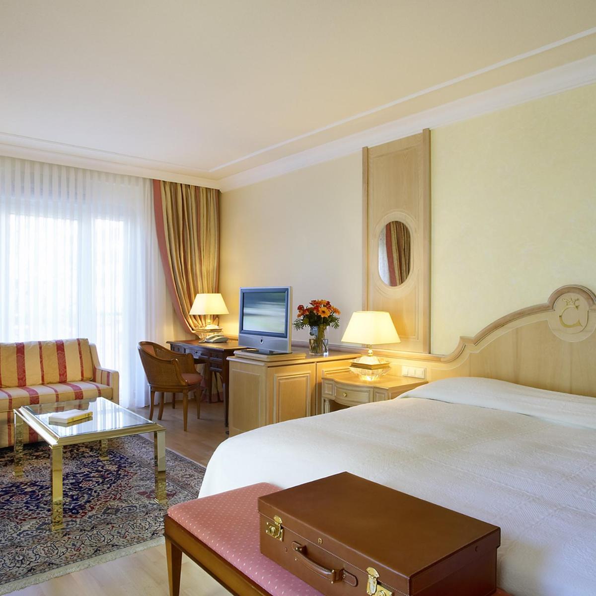 Ein Bett oder Betten in einem Zimmer der Unterkunft Colombi Hotel