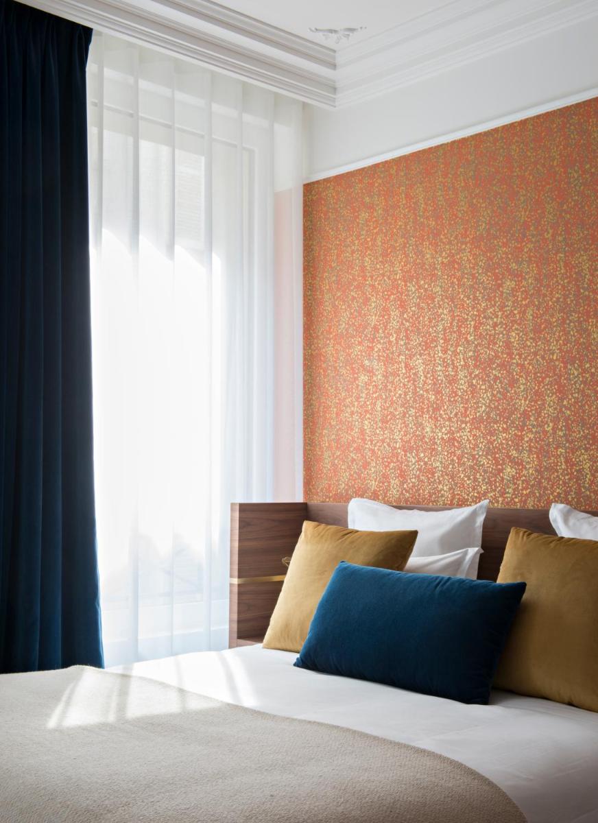 Un ou plusieurs lits dans un hébergement de l'établissement Hotel Parister Piscine & Spa