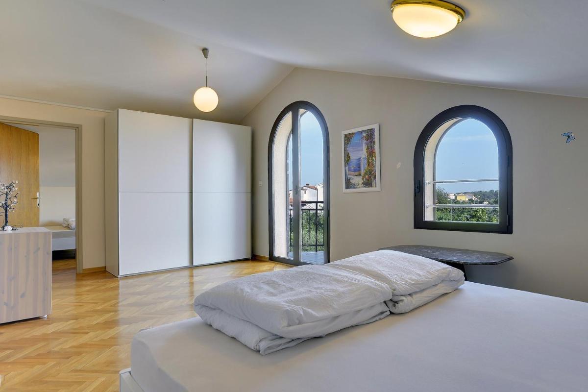 Villa Andrija Family Dream with heated pool at the sea with beautiful garden, outside cinema and kids playground - Housity