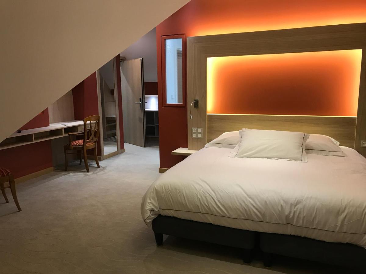 Un ou plusieurs lits dans un hébergement de l'établissement Au Soleil, Hôtel Restaurant & Spa
