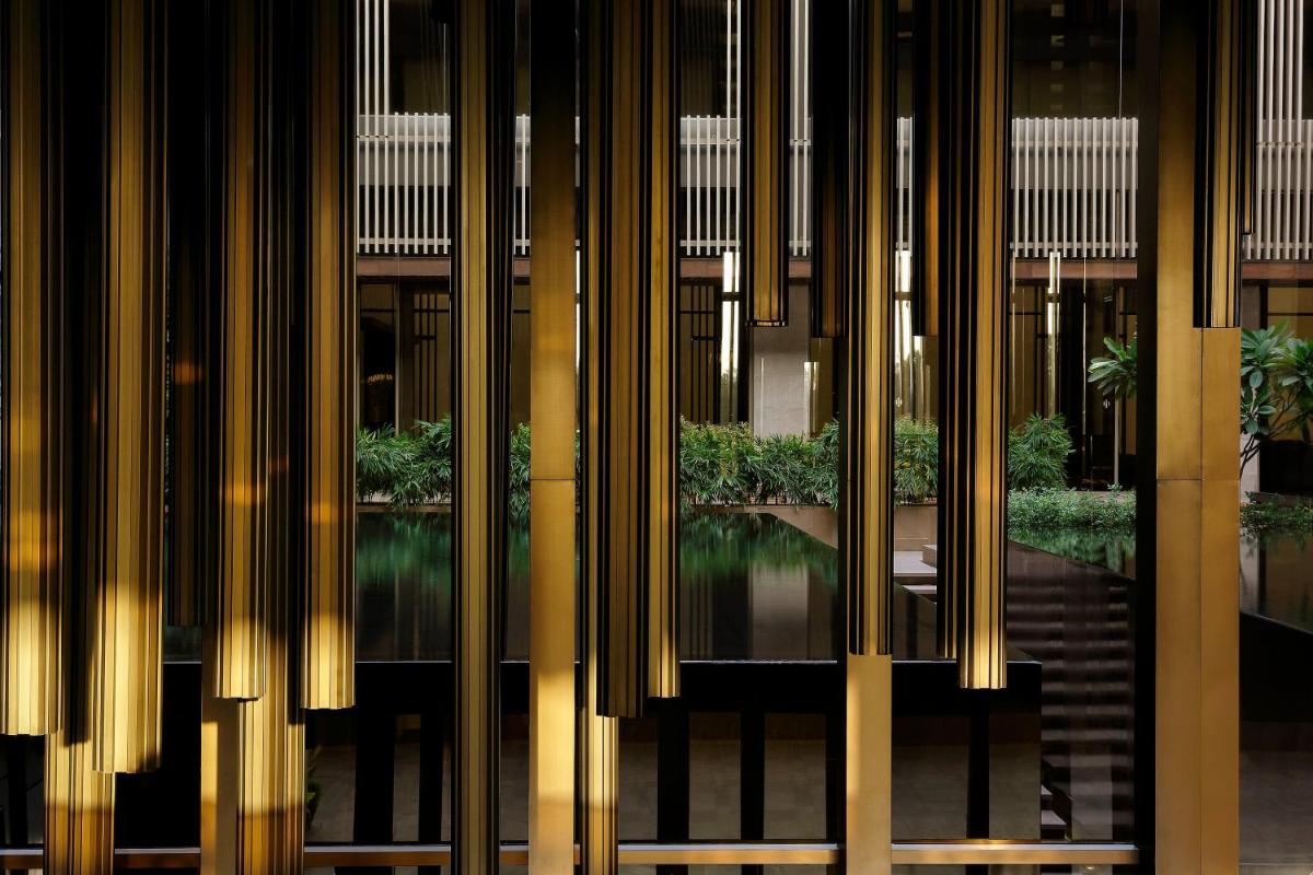 a view of a building through a glass window at Roseate House New Delhi in New Delhi a view of a building through a glass window at Roseate House New Delhi in New Delhi