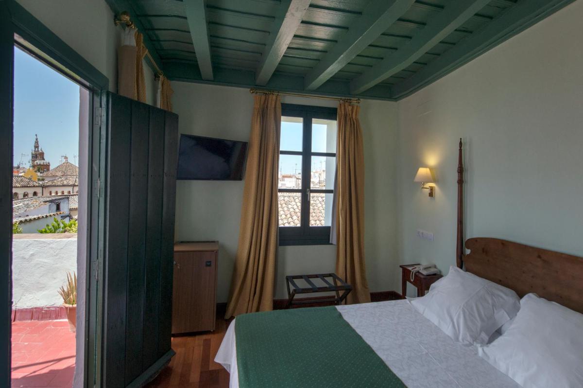 Cama o camas de una habitación en Hotel Las Casas de la Judería