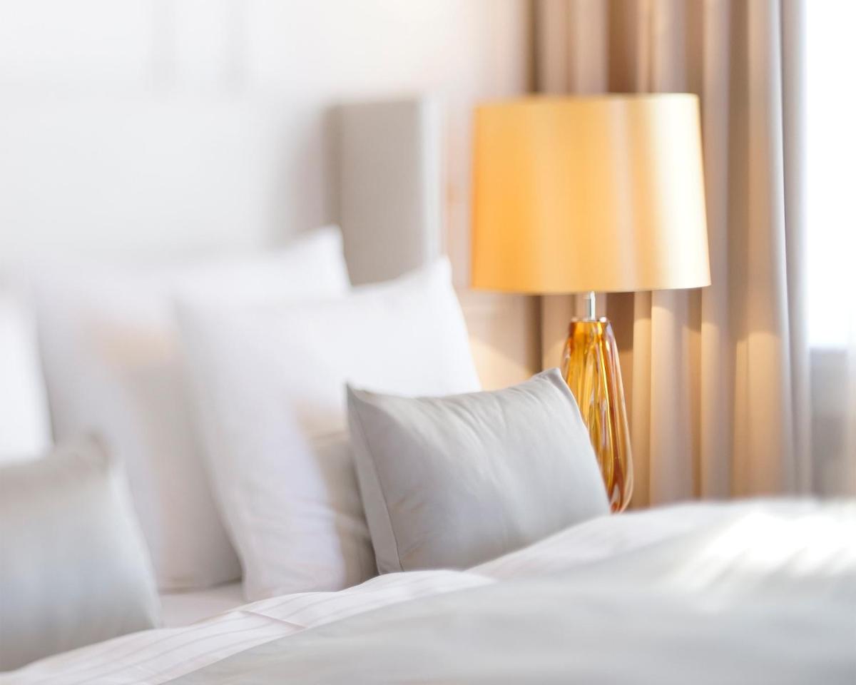 Ein Bett oder Betten in einem Zimmer der Unterkunft Das Tegernsee