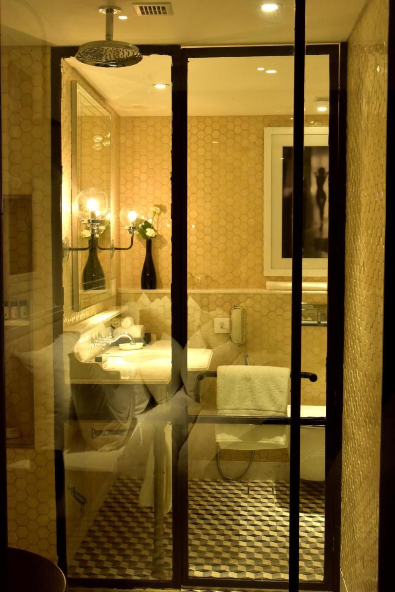 a bathroom with a sink and a mirror at Radisson Hotel Shimla in Shimla
