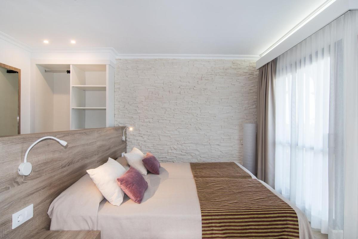 Cama o camas de una habitación en Hotel Na Taconera
