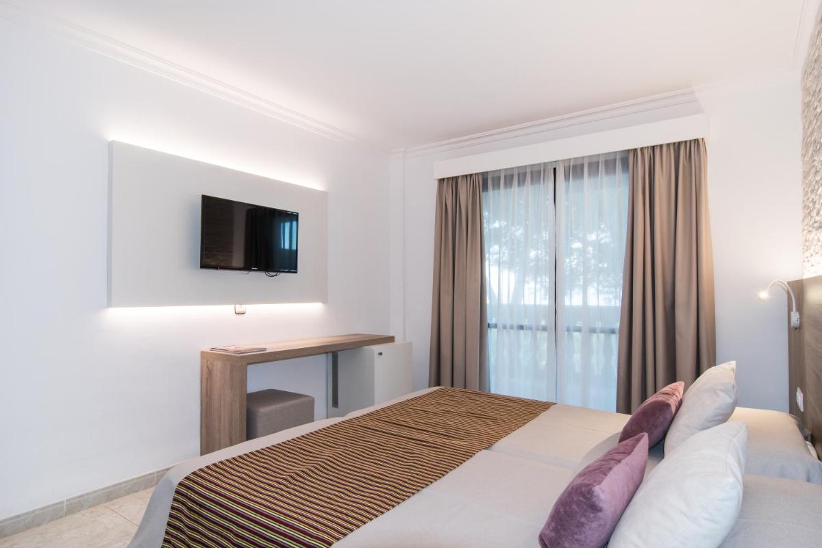Cama o camas de una habitación en Hotel Na Taconera