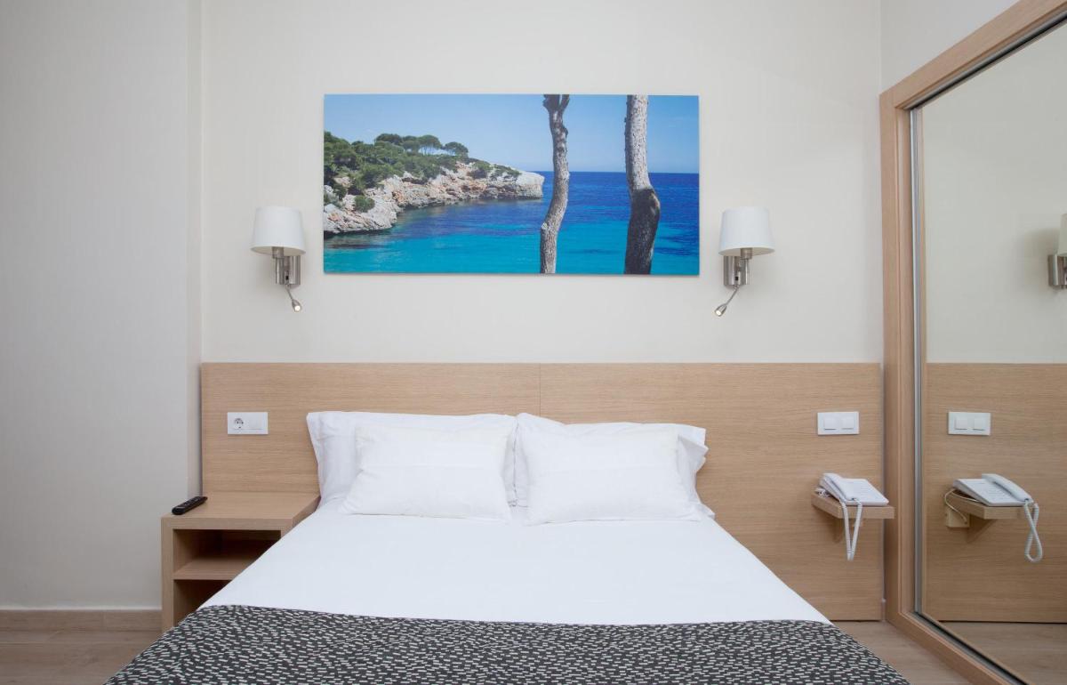 Cama o camas de una habitación en Hotel Samos