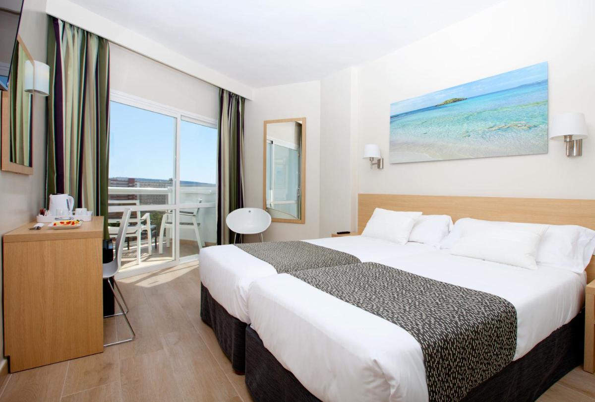Cama o camas de una habitación en Hotel Samos