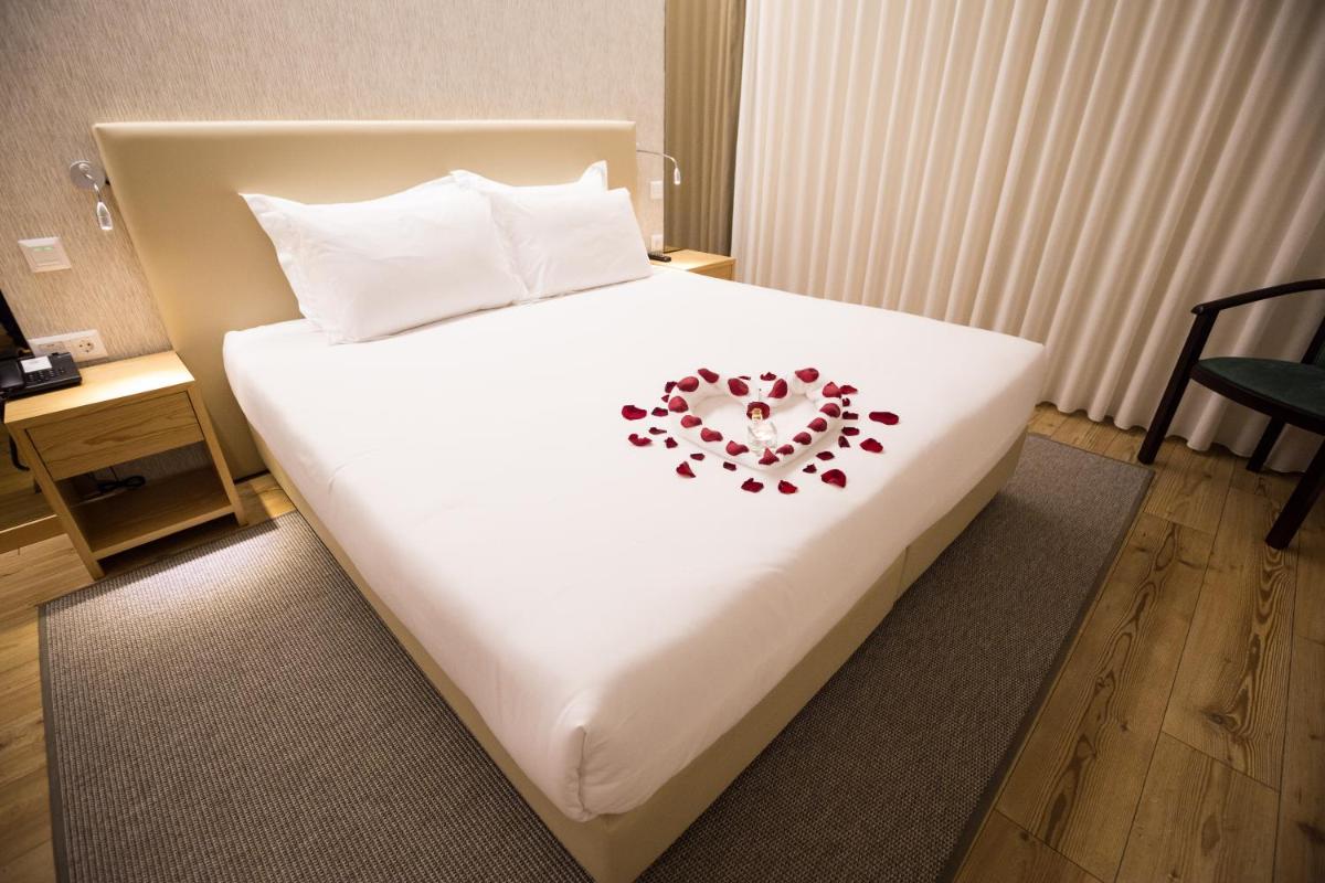 Uma cama ou camas num quarto em LAM Hotel Celorico de Basto