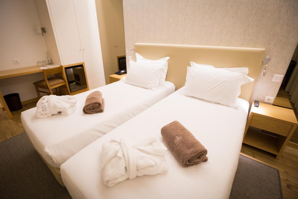 Uma cama ou camas num quarto em LAM Hotel Celorico de Basto