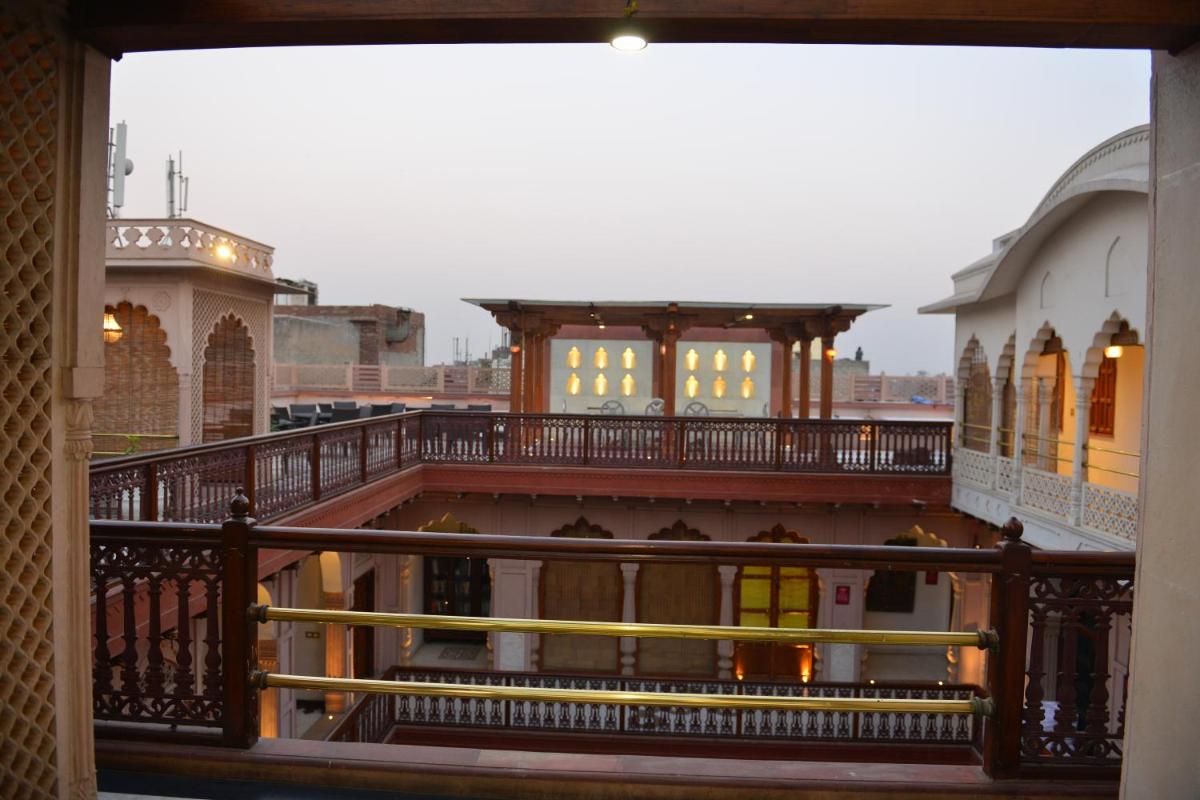 a view from the balcony of a building at Haveli Dharampura & Golden Haveli- UNESCO awarded Boutique Heritage Hotel in New Delhi a view from the balcony of a building at Haveli Dharampura & Golden Haveli- UNESCO awarded Boutique Heritage Hotel in New Delhi