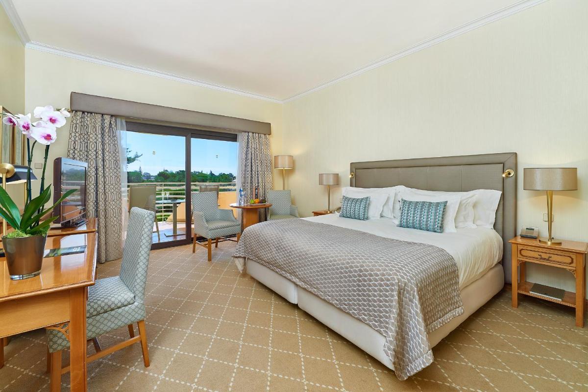 Uma cama ou camas num quarto em Hotel Quinta do Lago