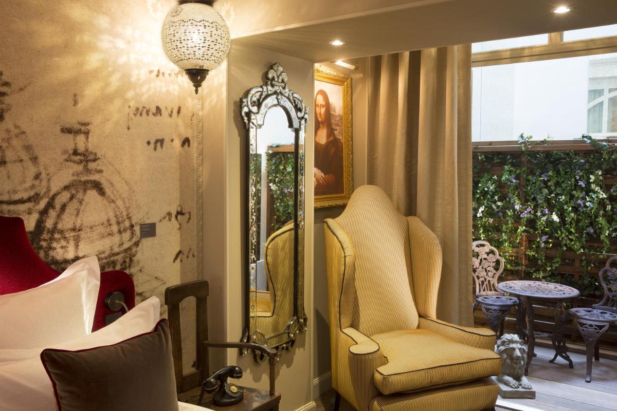 Coin salon dans l'établissement Hôtel Da Vinci & Spa
