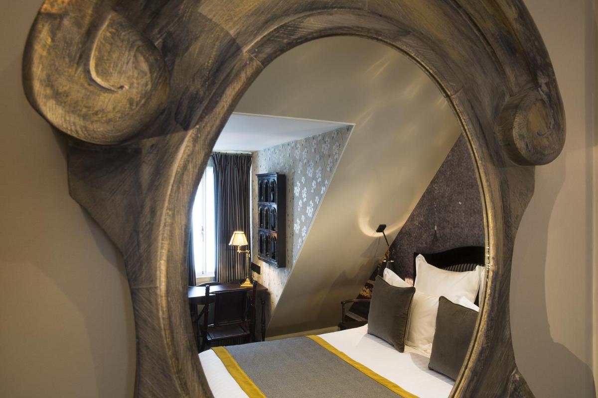 Un ou plusieurs lits dans un hébergement de l'établissement Hôtel Da Vinci & Spa