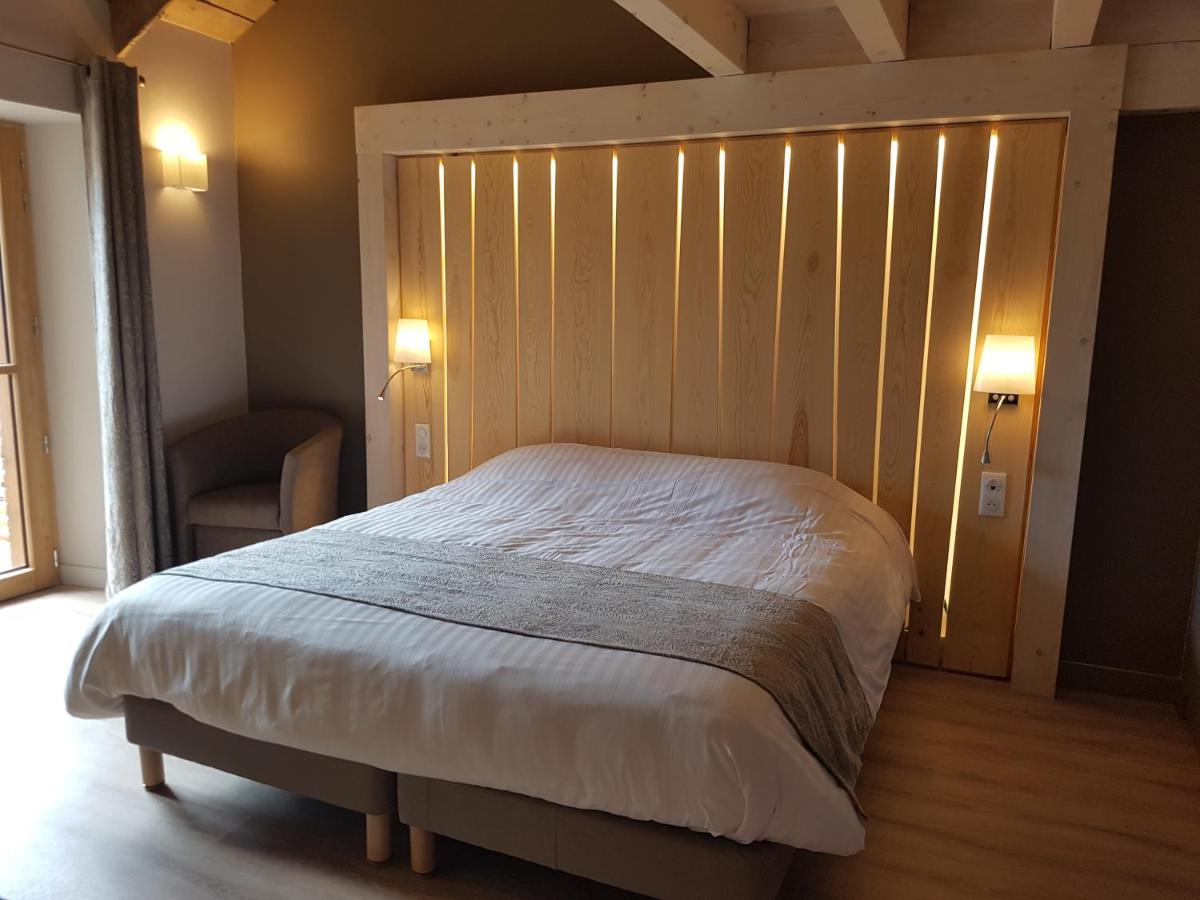 Un ou plusieurs lits dans un hébergement de l'établissement Logis SPA Hotel Restaurant De La Poste