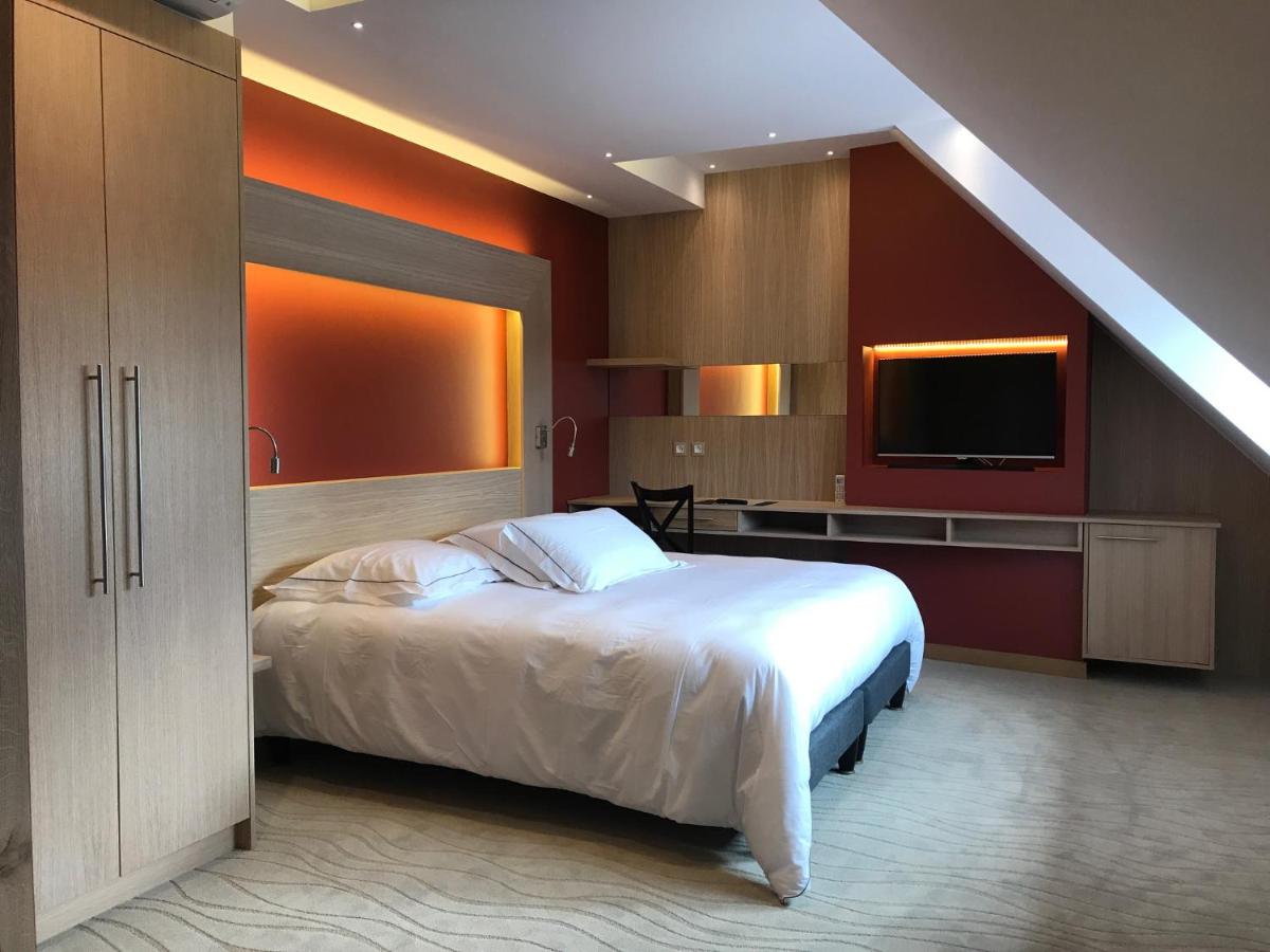 Un ou plusieurs lits dans un hébergement de l'établissement Au Soleil, Hôtel Restaurant & Spa