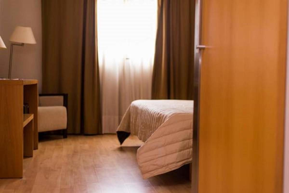 Cama o camas de una habitación en Executive Sport
