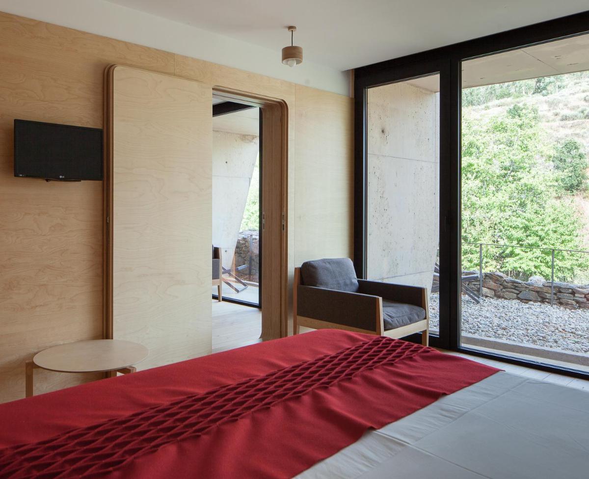 Uma cama ou camas num quarto em Colmeal Countryside Hotel