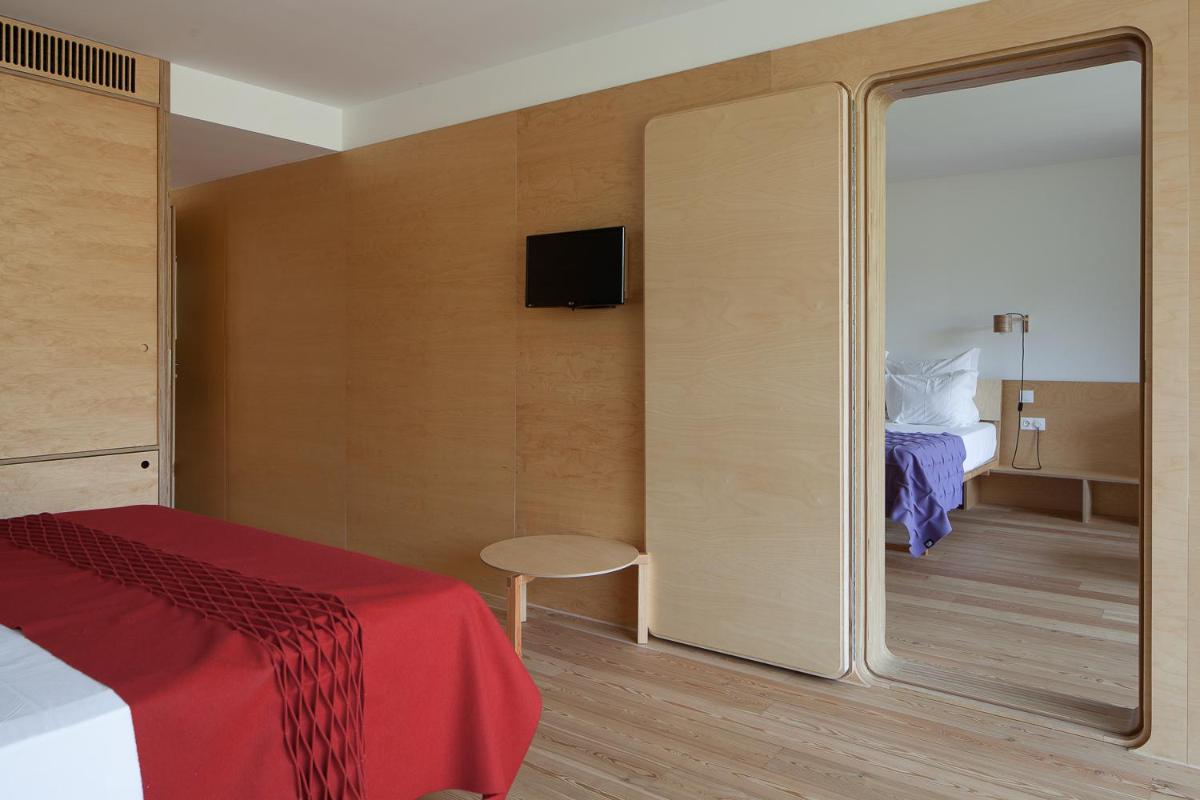 Uma cama ou camas num quarto em Colmeal Countryside Hotel