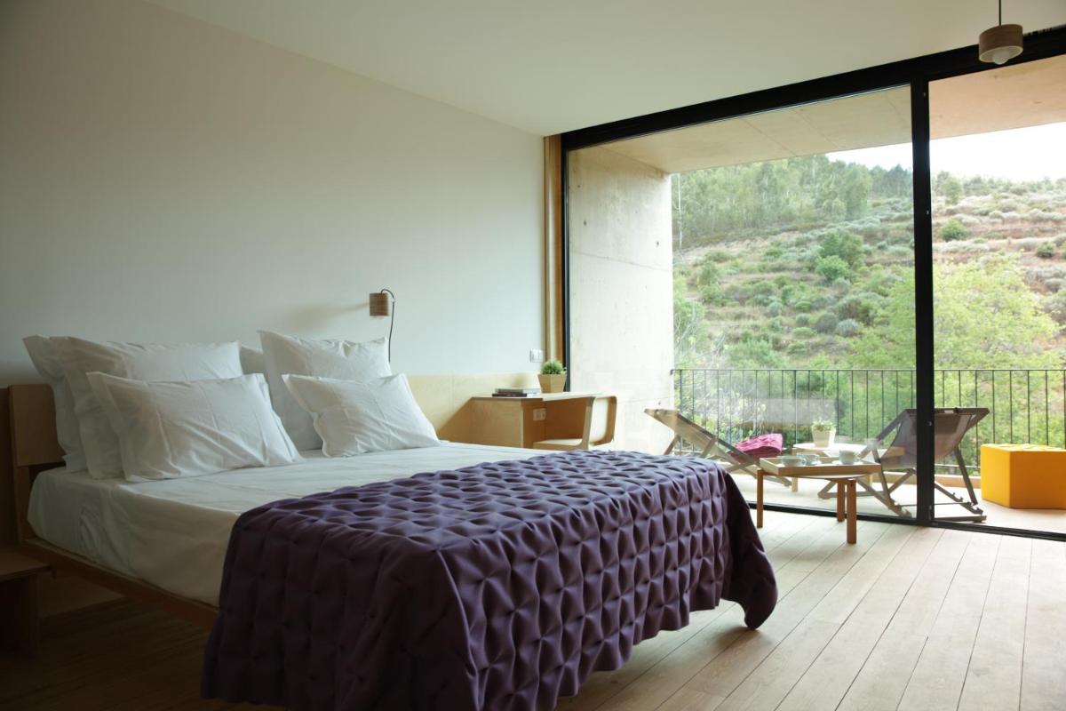 Uma cama ou camas num quarto em Colmeal Countryside Hotel