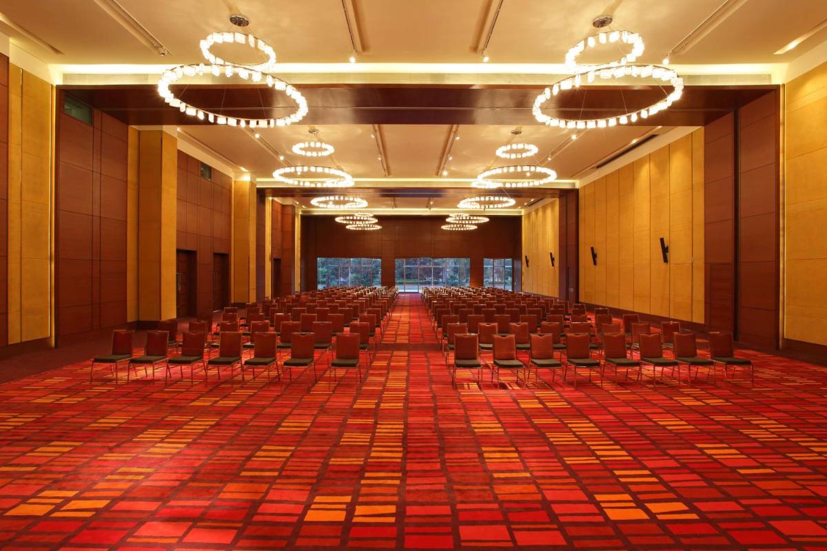 an empty conference room with chairs and chandeliers at Hyatt Regency Chandigarh in Chandīgarh