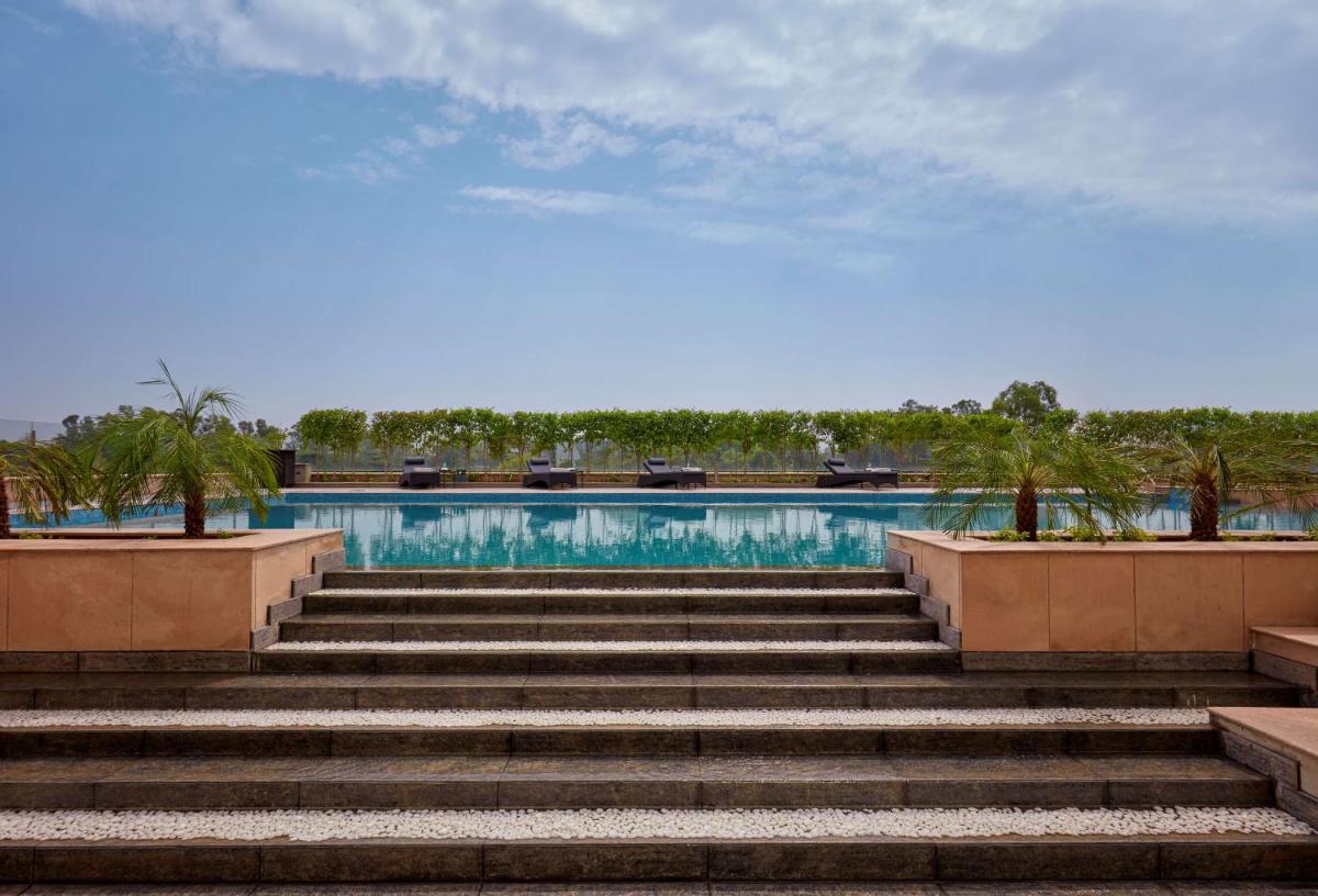 a set of stairs leading up to a swimming pool at Hyatt Regency Chandigarh in Chandīgarh