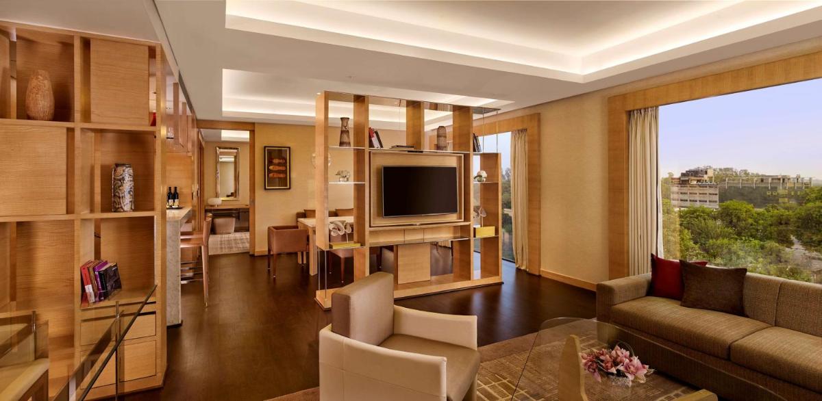 a living room with a couch and a television at Hyatt Regency Chandigarh in Chandīgarh