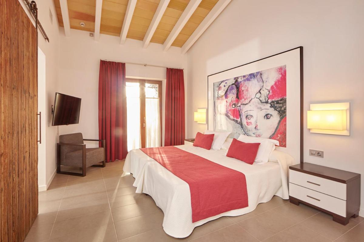 Cama o camas de una habitación en Bennoc Petit Hotel - Only Adults