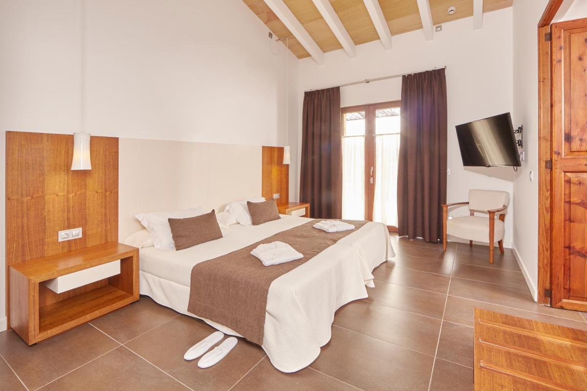 Cama o camas de una habitación en Bennoc Petit Hotel - Only Adults