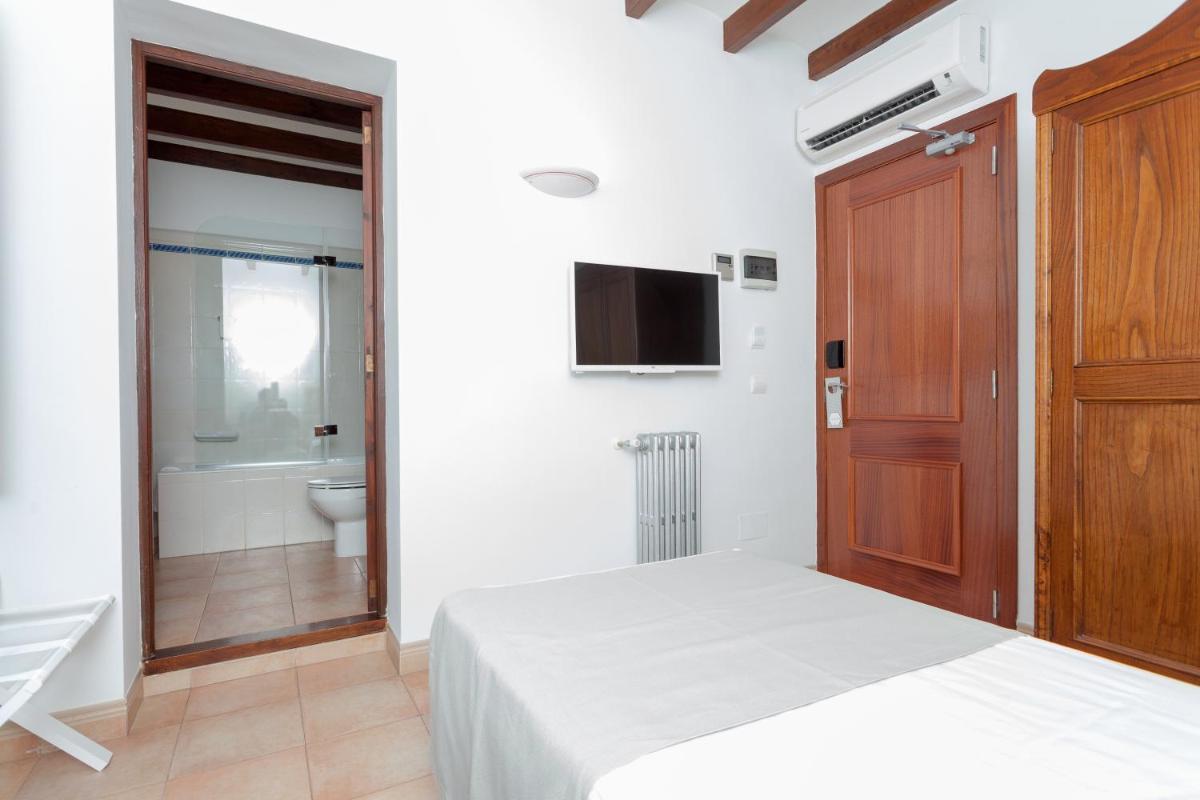 Cama o camas de una habitación en Hotel El Guía