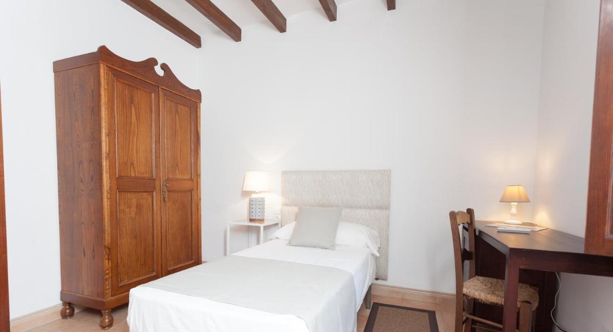 Cama o camas de una habitación en Hotel El Guía