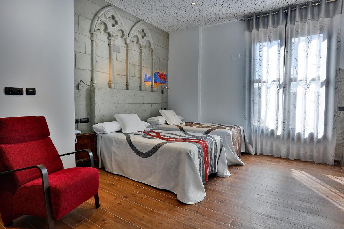 Cama o camas de una habitación en Hotel SPA El Lagar de Isilla