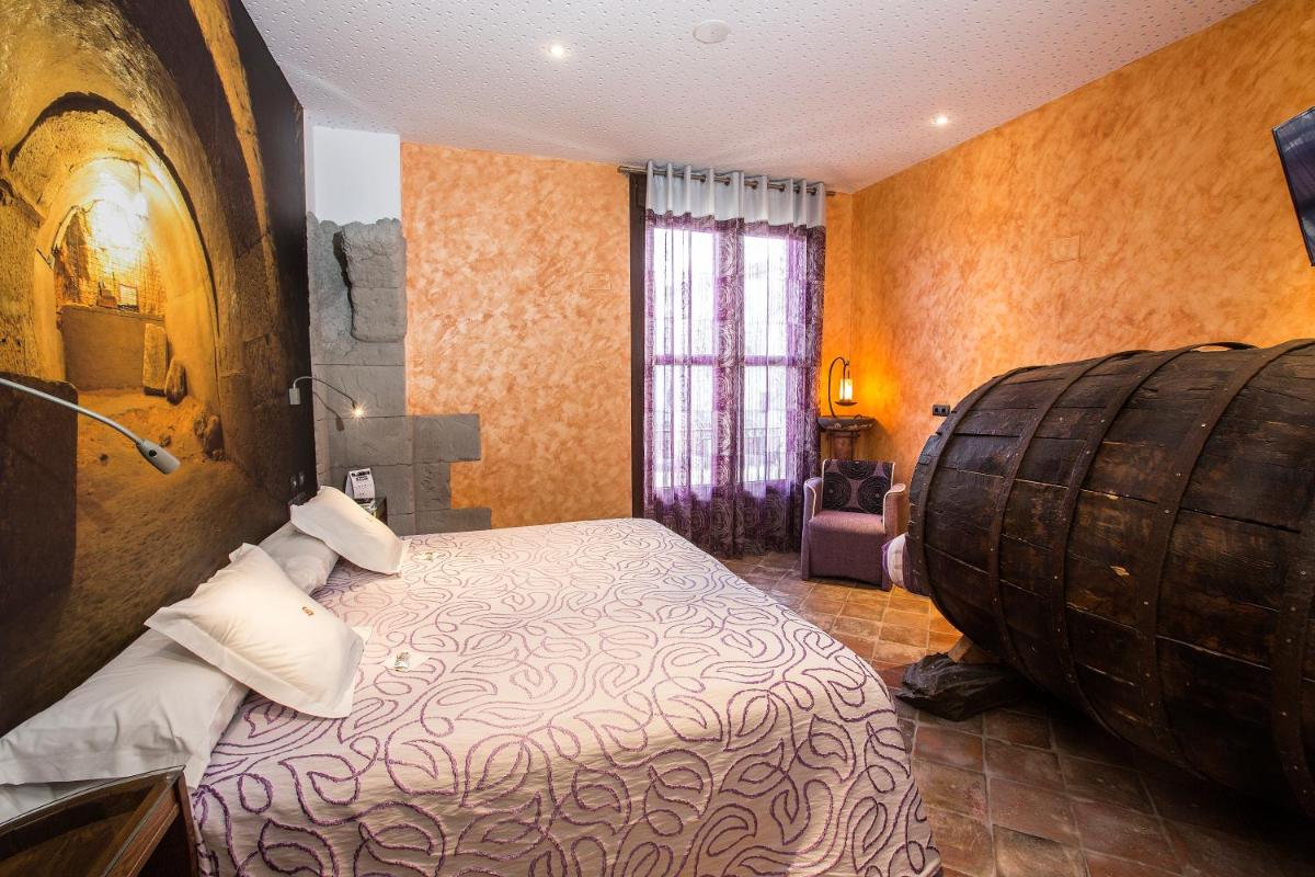 Cama o camas de una habitación en Hotel SPA El Lagar de Isilla
