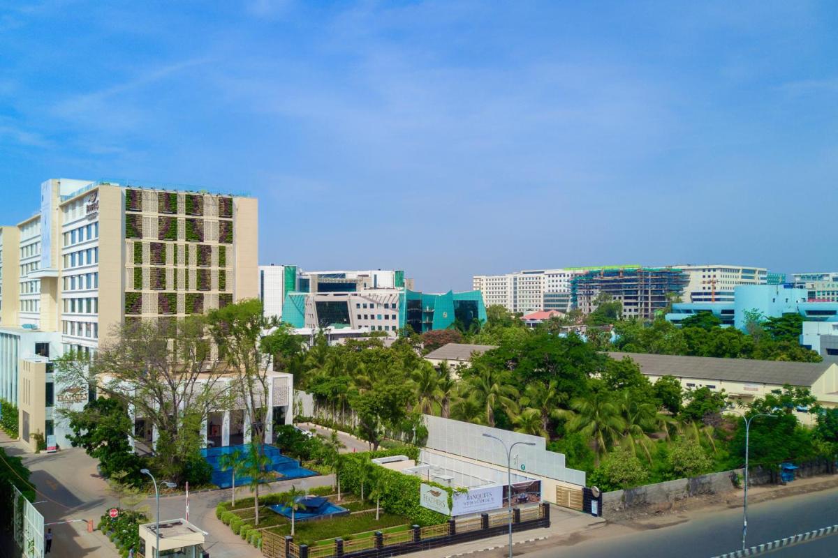 a view of a city with buildings and a street at Feathers- A Radha Hotel, Chennai in Chennai