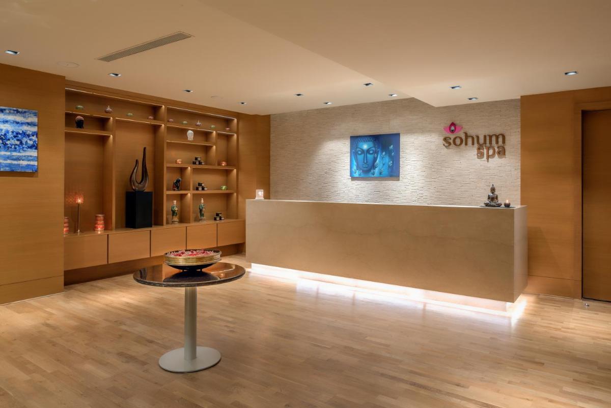 a lobby of a store with a counter and a table at Feathers- A Radha Hotel, Chennai in Chennai