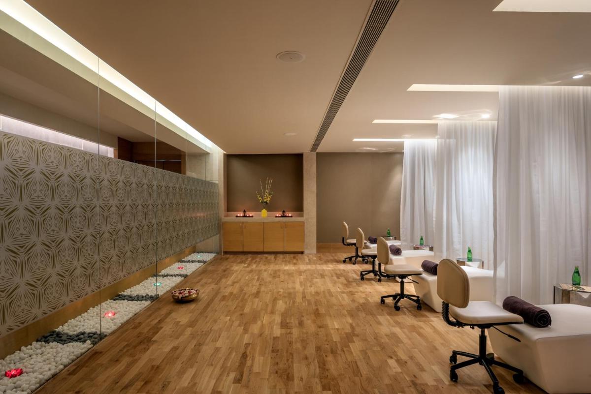 a salon with chairs and a waiting room at Feathers- A Radha Hotel, Chennai in Chennai