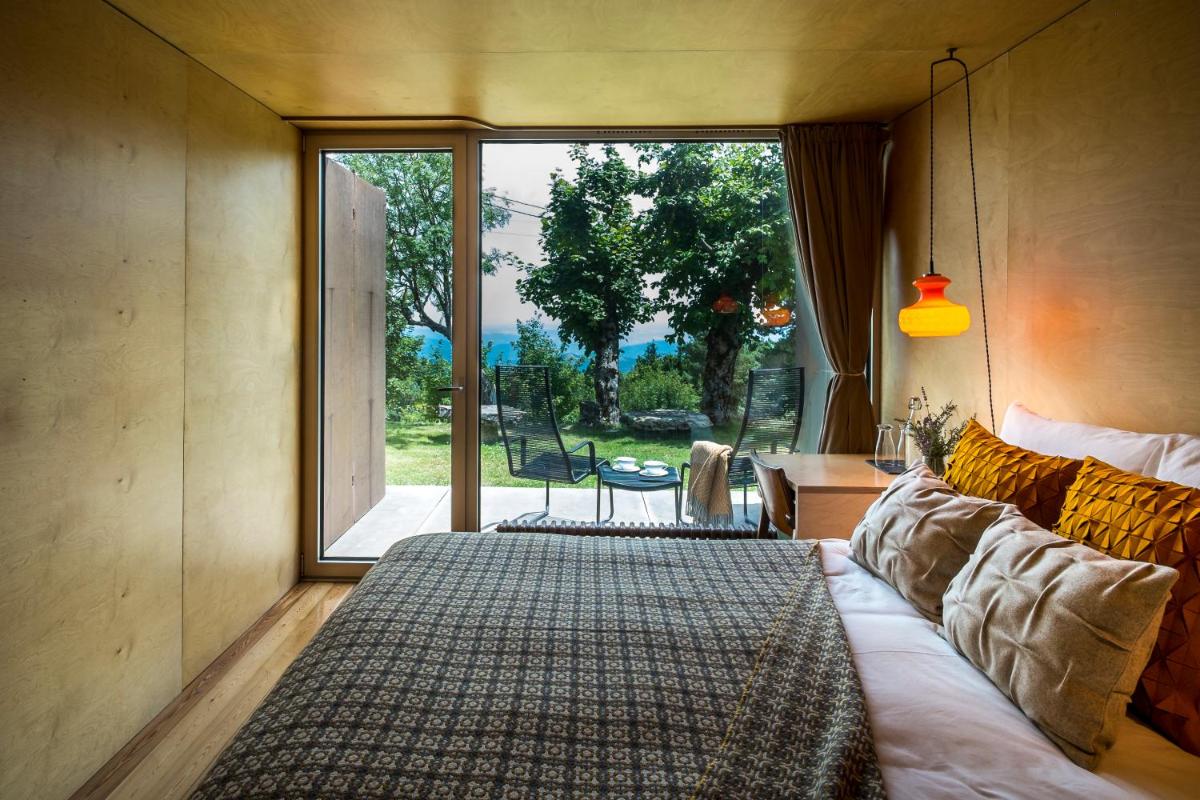 Uma cama ou camas num quarto em Casa das Penhas Douradas - Burel Expedition Hotel