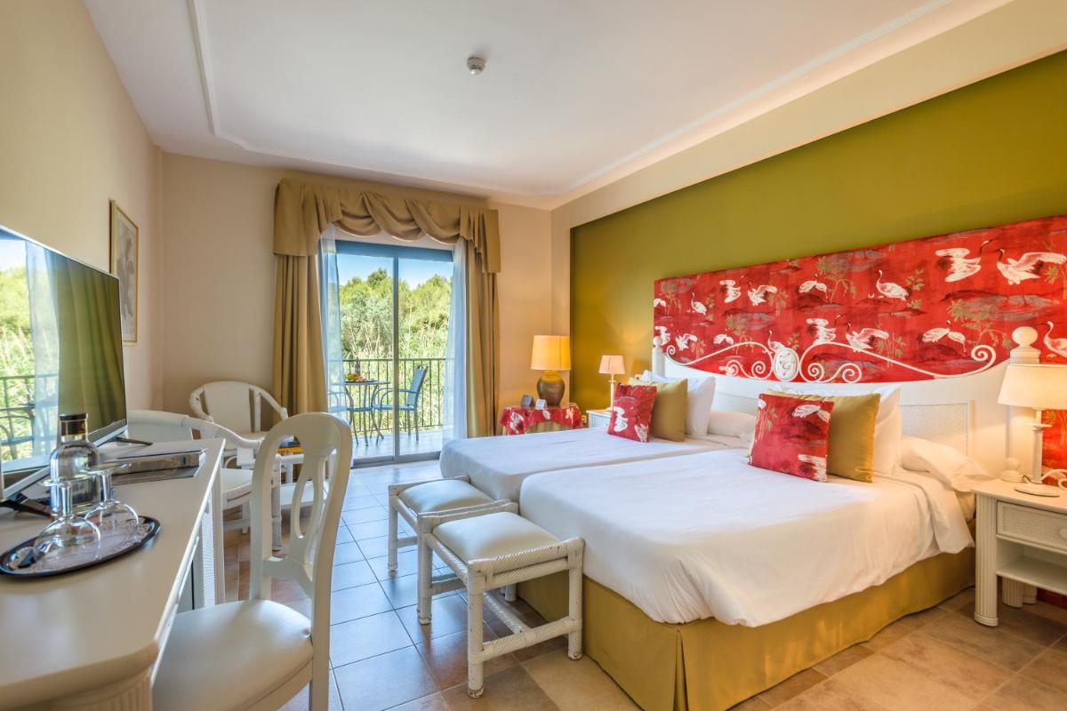 Cama o camas de una habitación en Lago Garden Apart-Suites & Spa Hotel