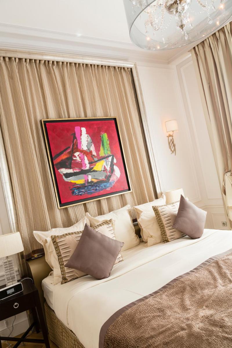 Un ou plusieurs lits dans un hébergement de l'établissement Majestic Hotel Spa - Champs Elysées